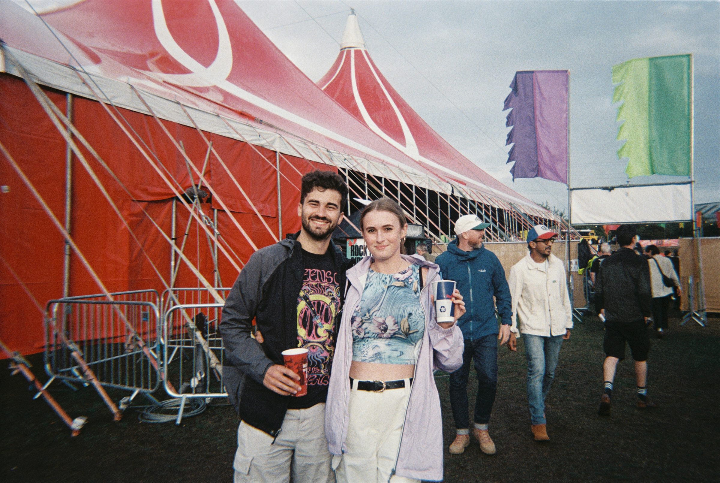 Callum and Celina outside the big top at a festival